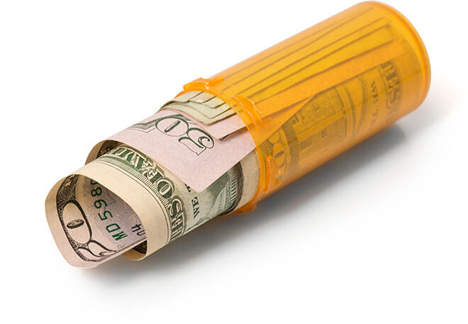 rolled-up bills in a prescription bottle